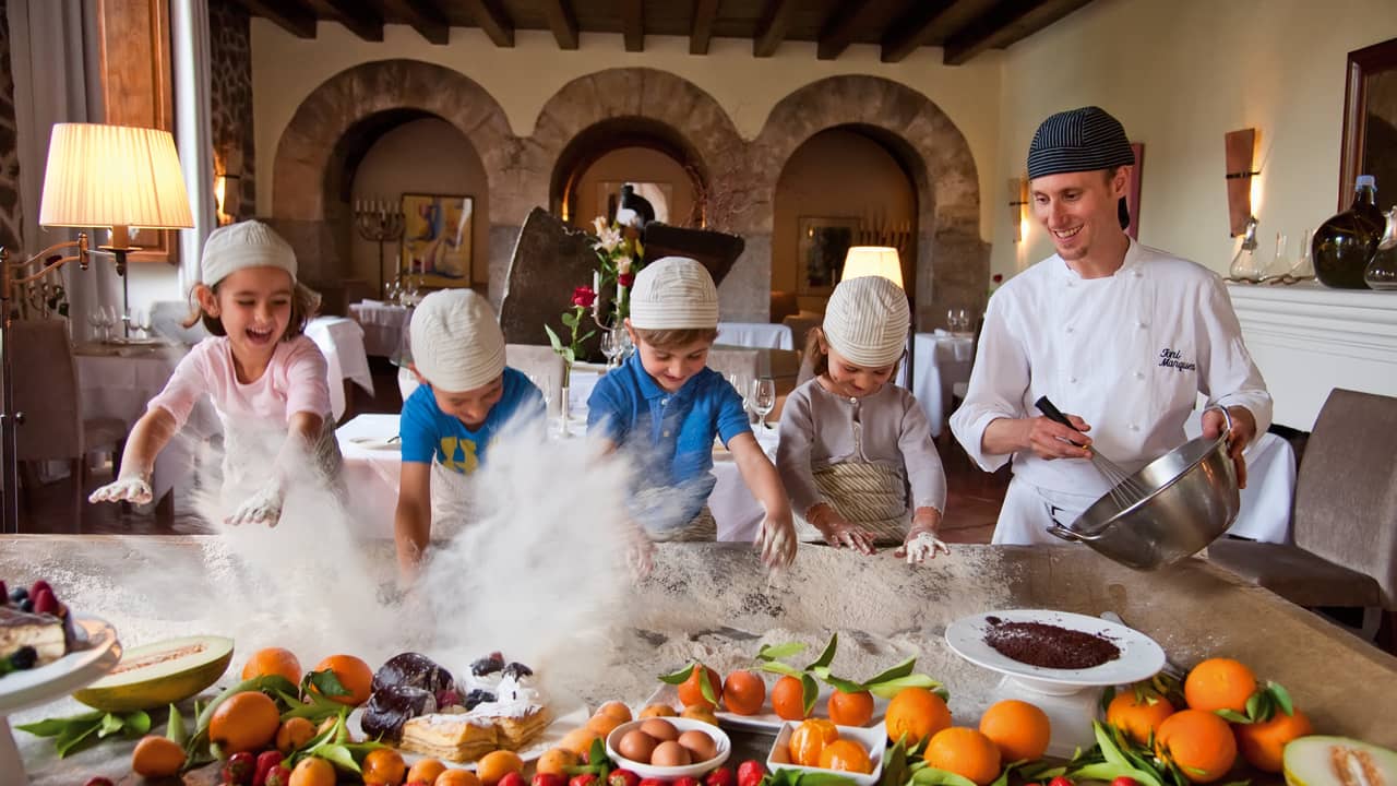 Children learning to cook at La Residencia