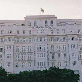 The art deco facade of Copacabana Palace with the hotel name in gold lettering