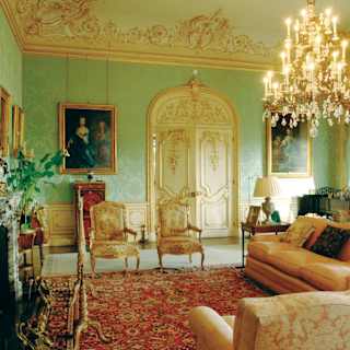 The drawing room of the Downton Abbey location, Highclere Castle, lavishly decorated with acres of gilt and giant chandelier
