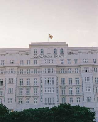 The art deco facade of Copacabana Palace with the hotel name in gold lettering