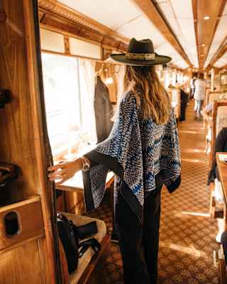 A women entering the Hiram Bingham restaurant car