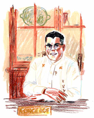 Crayon sketch by Damien Cuypers of Octavio Tovar, chief concierge of Casa de Sierra Nevada, sitting behind his desk.