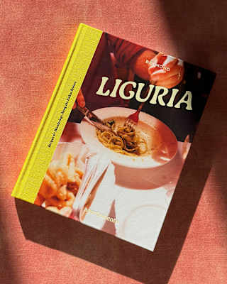 The cover of cookbook ‘Liguria: Recipes & Wanderings Along the Italian Riviera’ depicts a diner enjoying a bowl of spaghetti.