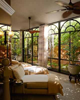 With day beds and floor-to-ceiling windows filtering sunlight and foliage views, the spa is like a garden room for the soul.