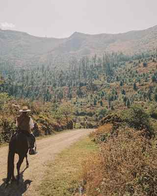 Man exploring the Sacred Valley on horseback