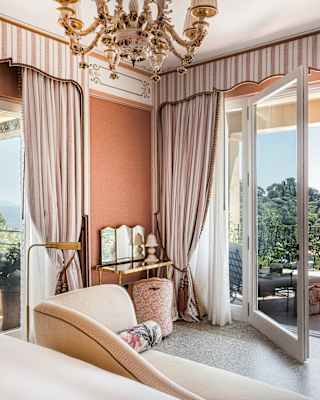 With peach and cream décor, the Baronessa Suite embraces Mediterranean warmth with large glass doors to a terrace and garden.
