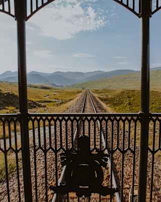 A shot from the Observation Deck captures the dynamic rugged highlands with moss and heather fields and distant mountains.