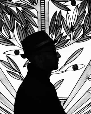 A silhouette of artist, JR in front of a stained glass design of an olive tree sprouting leaves and two eyes, in monochrome.