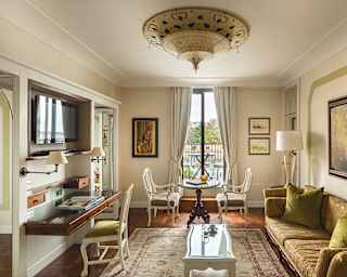 Elegant suite living room with plush classical Venetian furnishings and lime green accents