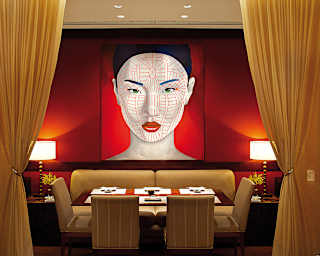 Contemporary portrait of an asian lady hanging above a restaurant table
