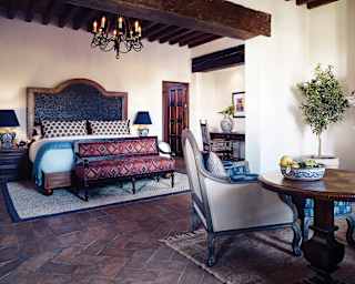 Elegant hotel room with stone tiled floors and Spanish colonial styling