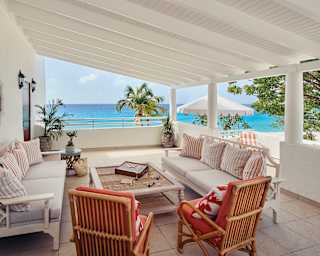 Sheltered terrace seating area overlooking the Caribbean sea