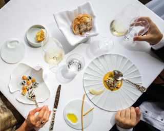 Served on unique plates, a dish of prawns with green lemon, and one of oysters with camomile offer visually stunning dining.