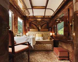With walnut panelling, russet velvet seats and a carpet in swirling mushroom shades, La Forêt Suite glows with warm tones.