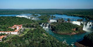 An aerial panorama show the hotel and its gardens are immediately alongside the spectacular cascades of the Iguassu Falls