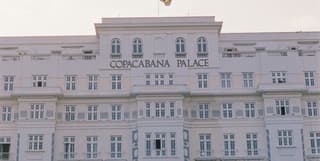 The art deco facade of Copacabana Palace with the hotel name in gold lettering 