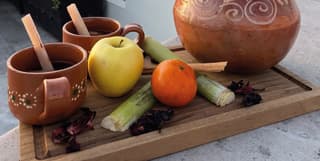 A board of natural ingredients for the menu at Andanza Restaurant with rooftop views of San Miguel de Allende beyond