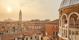 View from Scala del Bovolo across the Venetian skyline at sunset