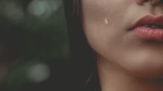 close up of a crying woman's face