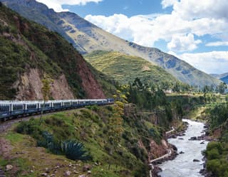 The Andean Explorer weaves through the verdant Andes en-route to Lake Titicaca, following the meandering Urubamba River.