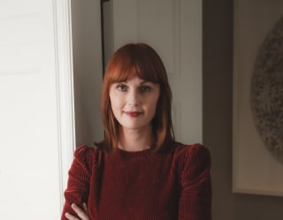 Skincare expert to the stars, so-called 'super facialist' Teresa Tarmey, stands relaxed with her arms folded at the spa entrance