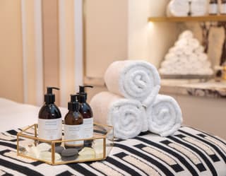 the spa bed with the elemental herbology products at the cadogan
