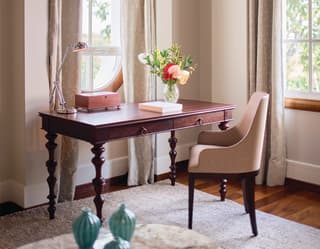 Mahogany desk at a window in an elegant hotel room