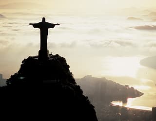 Rio's iconic 'Christ the Redeemer' statue rising into the clouds above the city