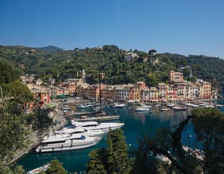Aerial view of luxury yachts anchored in Portofino harbour