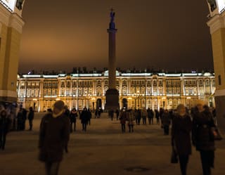 Illuminated facade of the Winter Palace in St Petersburg against the night sky