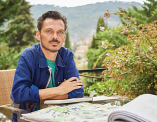 British interior designer Matthew Williamson who lives in the exclusive mountain village of Deia