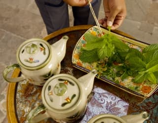 Afternoon tea is served, Peruvian style ¬– with green coca leaves