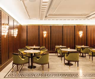 Theatre bar area with grecian mosaic flooring and walnut wall panelling