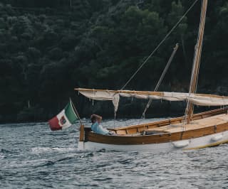 A man on a boat in Portofino sea