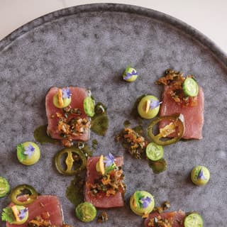 Close up of tuna decorated with edible flowers