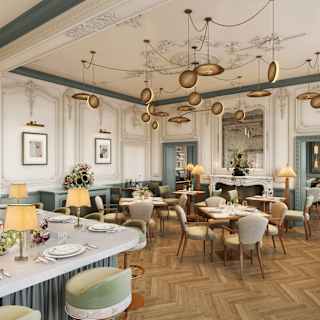 View over Willett's bar and bistro, where modern parquet, lighting and dining tables blend with antique grey and white décor.