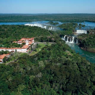 An aerial panorama show the hotel and its gardens are immediately alongside the spectacular cascades of the Iguassu Falls