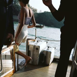 Guest boarding the Shuttle Boat with luggage
