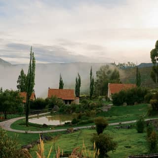 The hotel’s individual casitas and gardens overlooking Peru’s mountainous and misty Colca Canyon