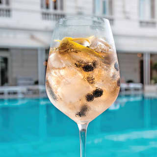 White-wine cocktail on a poolside table in Rio de Janeiro