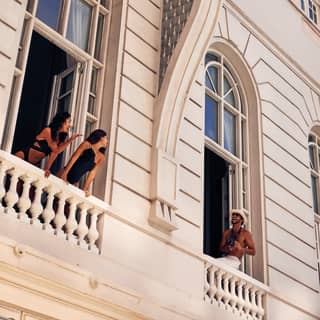 people talking over separate balconies