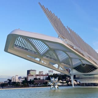 A vast, steel, avant-garde, spiky museum structure stretching over water