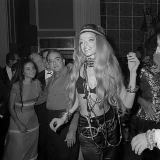 A 1960s image of the German supermodel Veruschka von Lehndorff as she enjoys the carnival party dressed in hippy chic