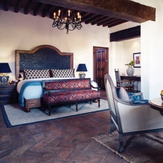 Elegant hotel room with stone tiled floors and Spanish colonial styling