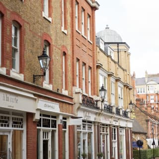 A Chelsea high-street lined with luxury boutiques, cafes and delicatessens