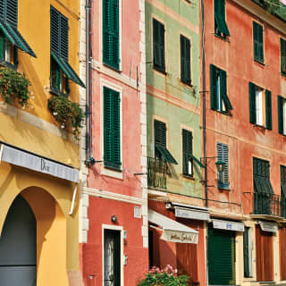 Close-up of an assortment of yellow, pink, green and red town houses