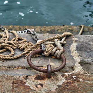 Old rusty metal and ropes on Portofino harbour 
