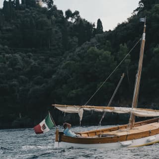A man on a boat in Portofino sea