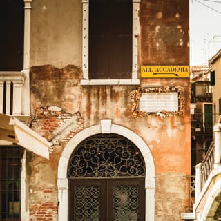 Exterior of a traditional house by lagoon in Venice