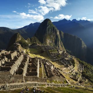 Breathtaking view over the temples and terraces of the ancient Inca citadel of Macha Picchu, nestled in a mountain cradle.